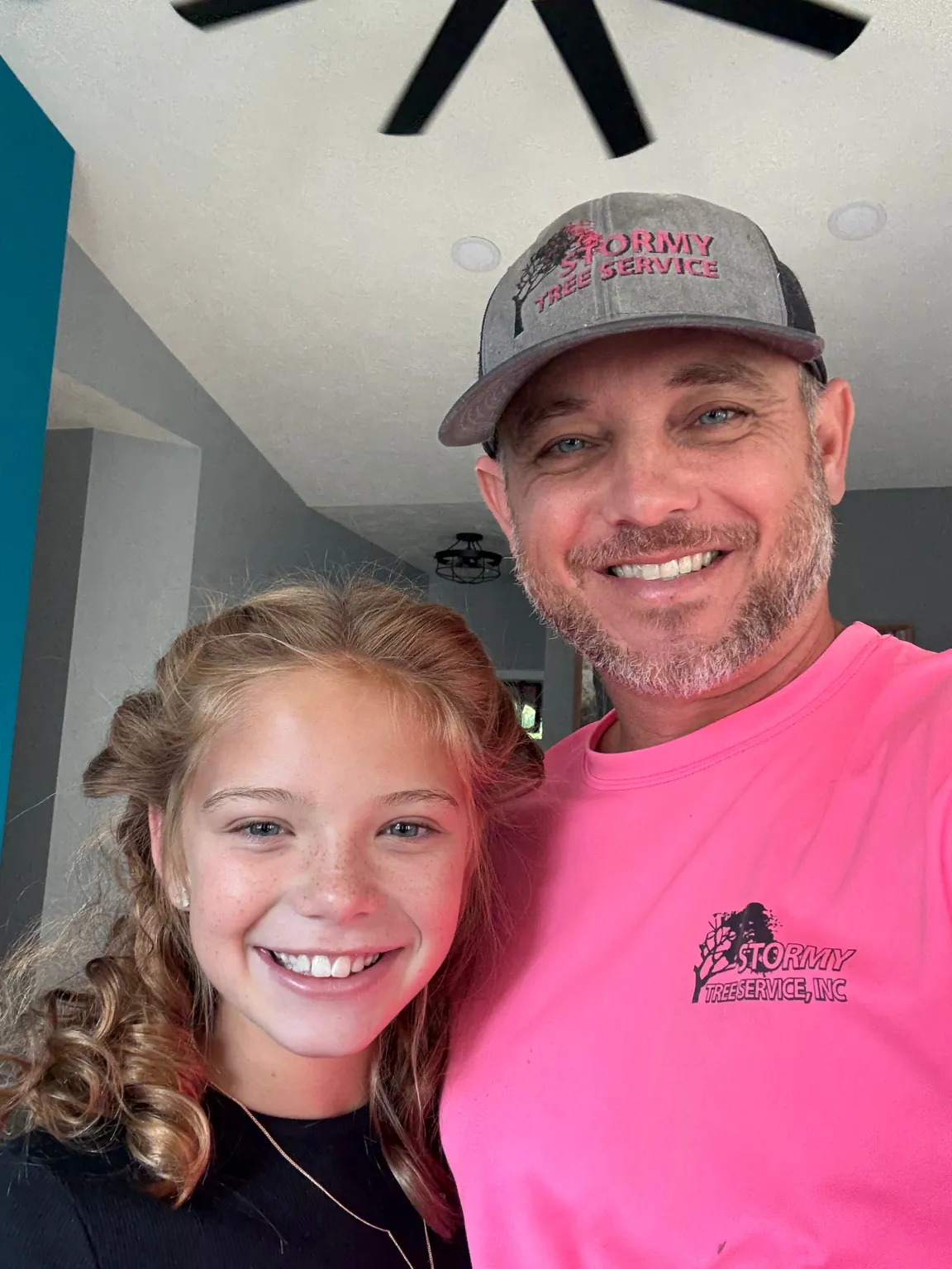 Jake, owner of Stormy Tree Service, with his daughter